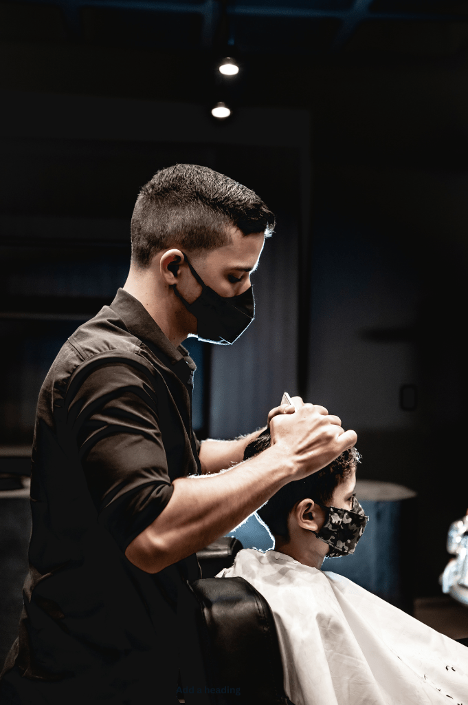 Noah Bennett, Men's Stylist & Grooming Specialist at Salon 1150, expertly crafting a clean fade haircut in a luxurious Austin salon setting.