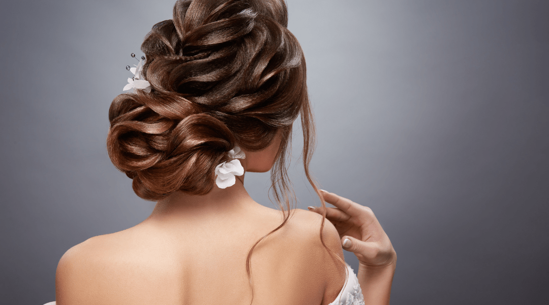 Elegant bridal hairstyle from the back, showcasing intricate styling for a special occasion.