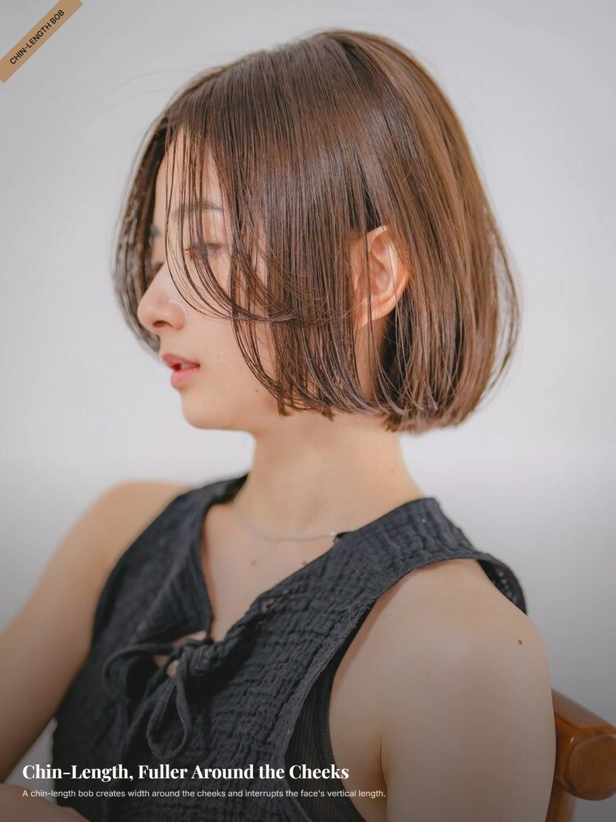 Woman with a long face wearing a chin-length bob with fullness around the cheeks
