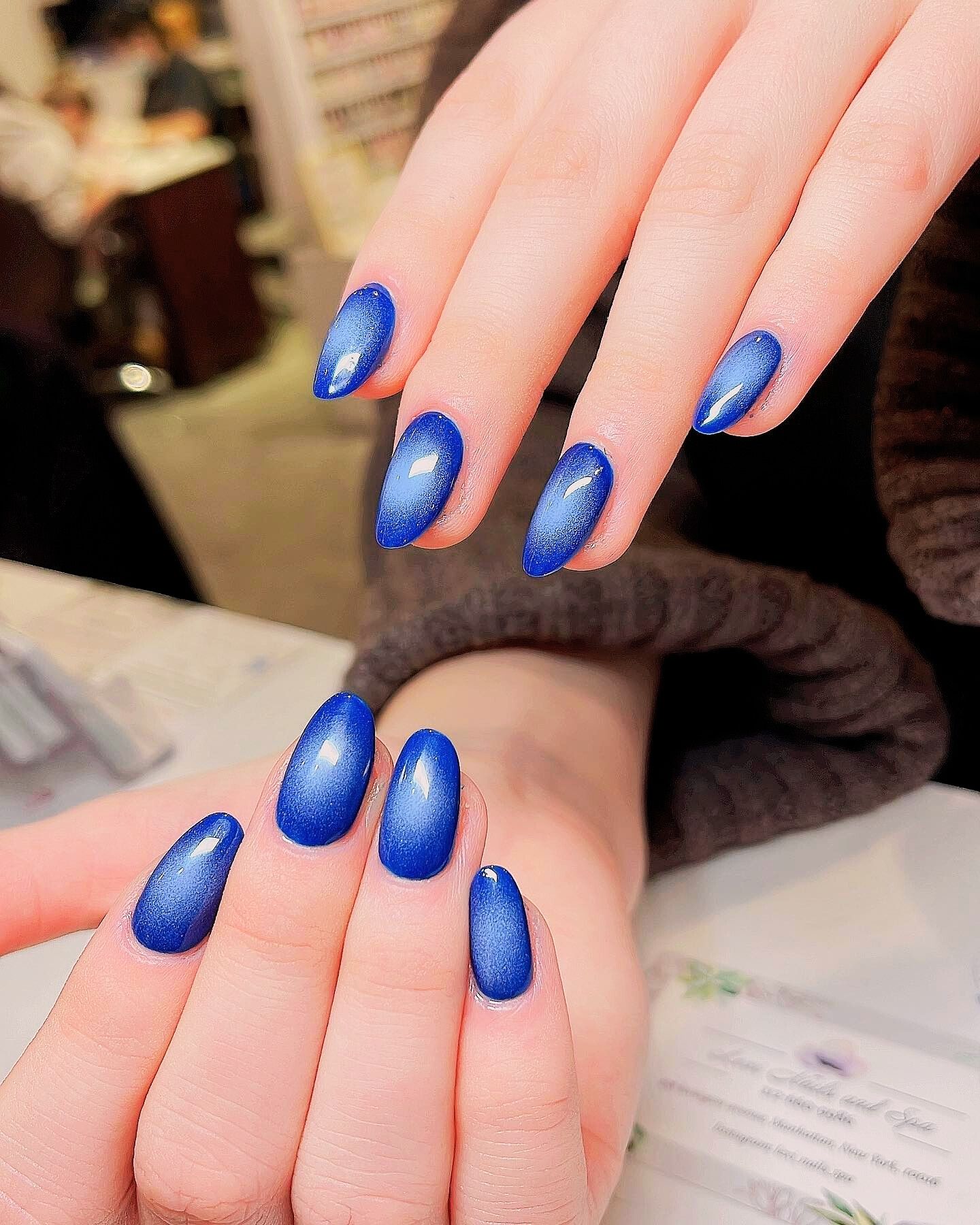 Blue aura nails with metallic silver accents for a calming, celestial vibe. Soft blue gradient and silver metallic tips create a chic, modern look.
