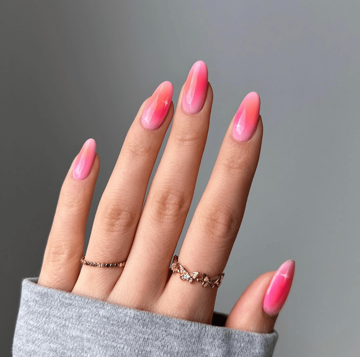 Close-up of Modern Aura Nails with soft pastel hues and metallic accents, showcasing a stylish and contemporary design.