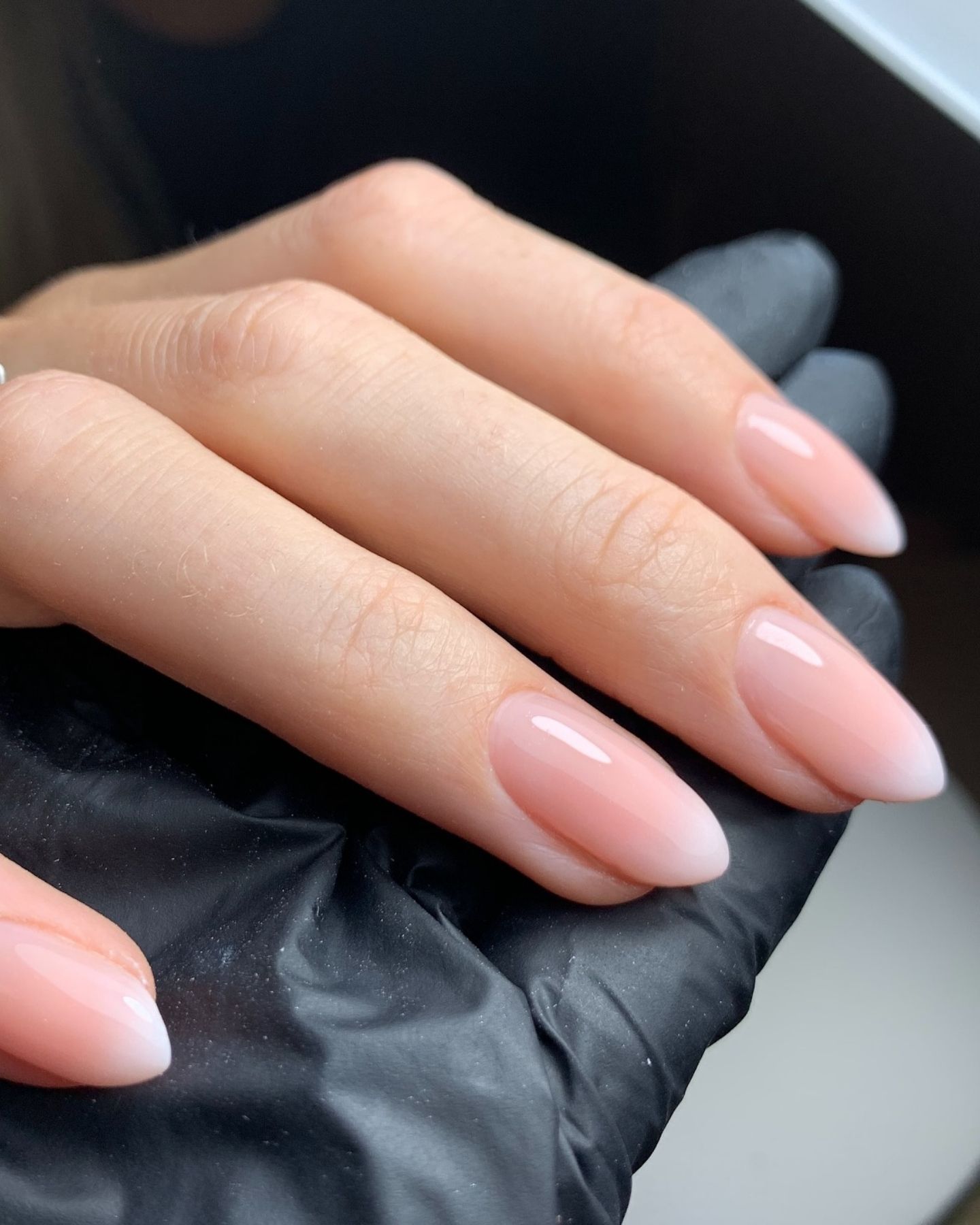 Short square nails with pink reverse French ombre fade and crisp white tips for a soft gradient nail design