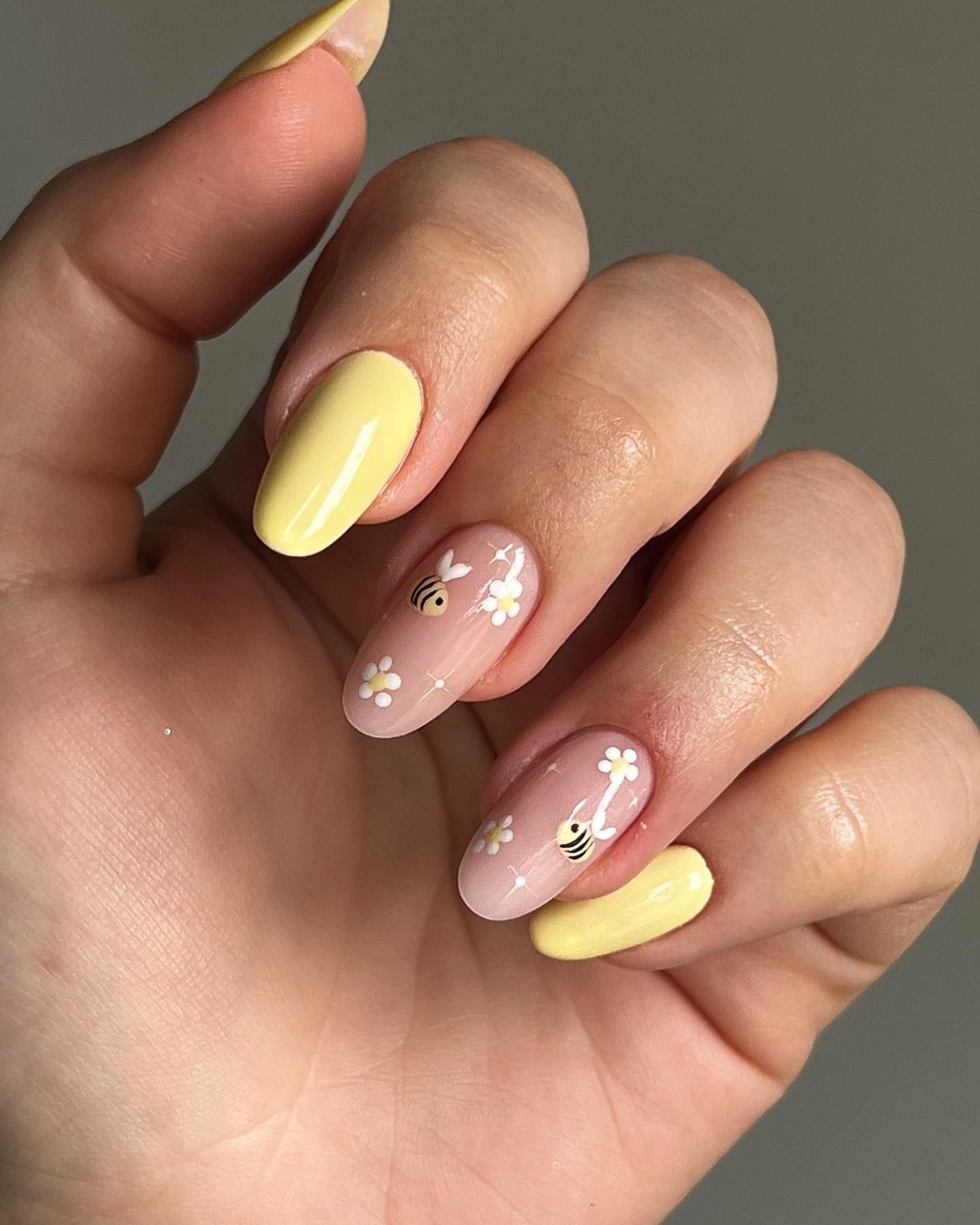 Close-up of Summer Yellow Mix nail art with French tips, ombre effect, and delicate butterfly details, showcasing a vibrant and playful design perfect for spring and summer.