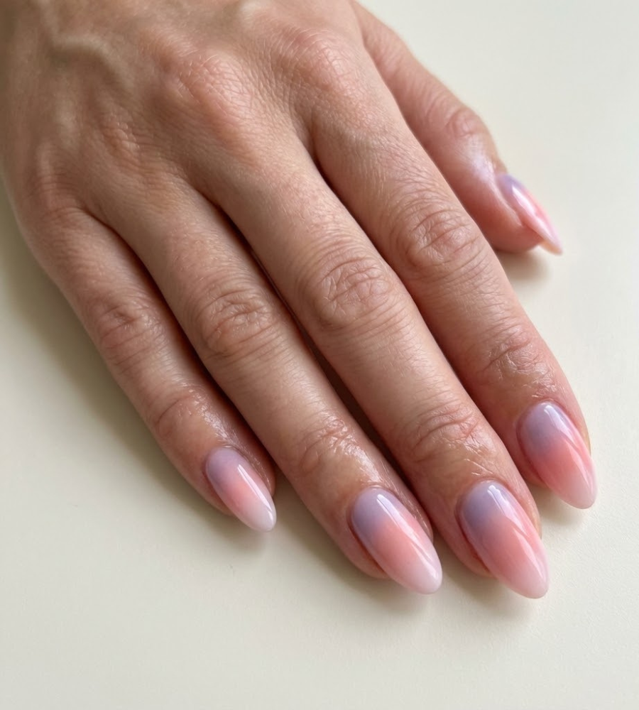 Pink sky inspired gradient nails with soft pastel tones