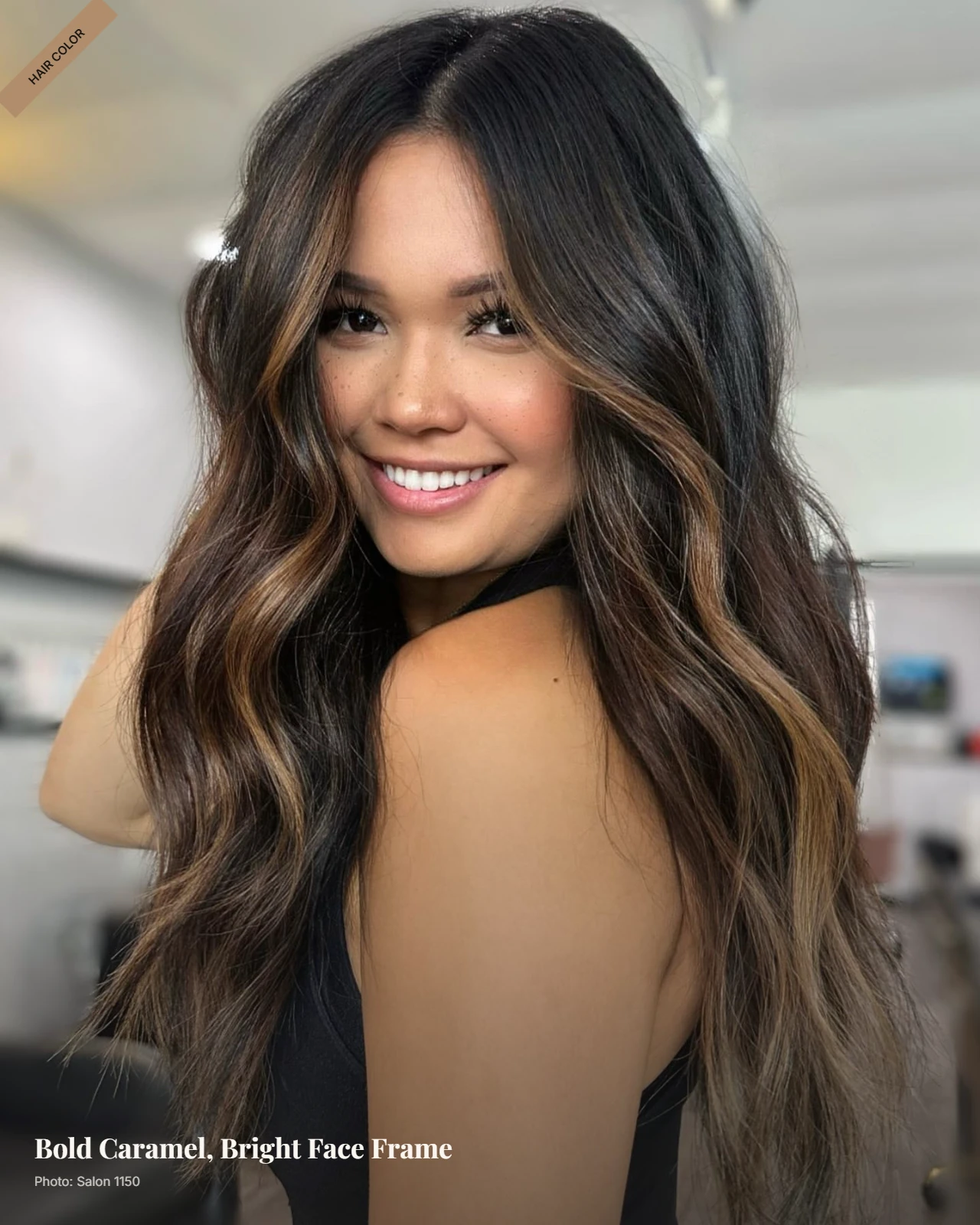 Dark brown hair with bold caramel money pieces framing the face in soft waves