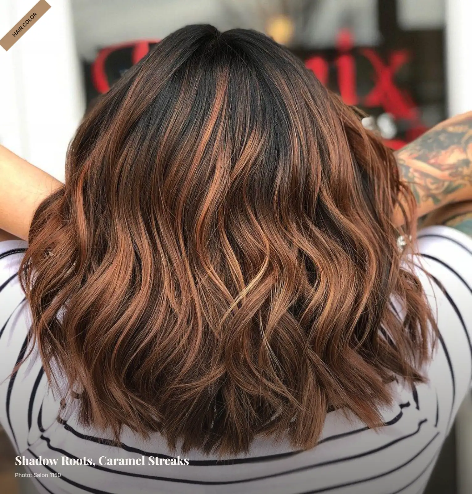 Mid-length brunette hair with dark shadow roots and soft caramel streaks in waves