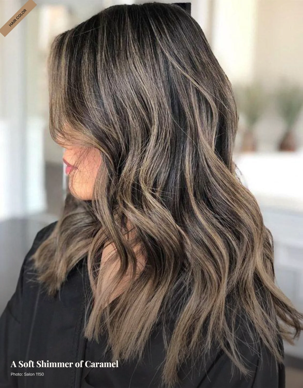 Fine caramel babylights woven through brunette hair in soft waves