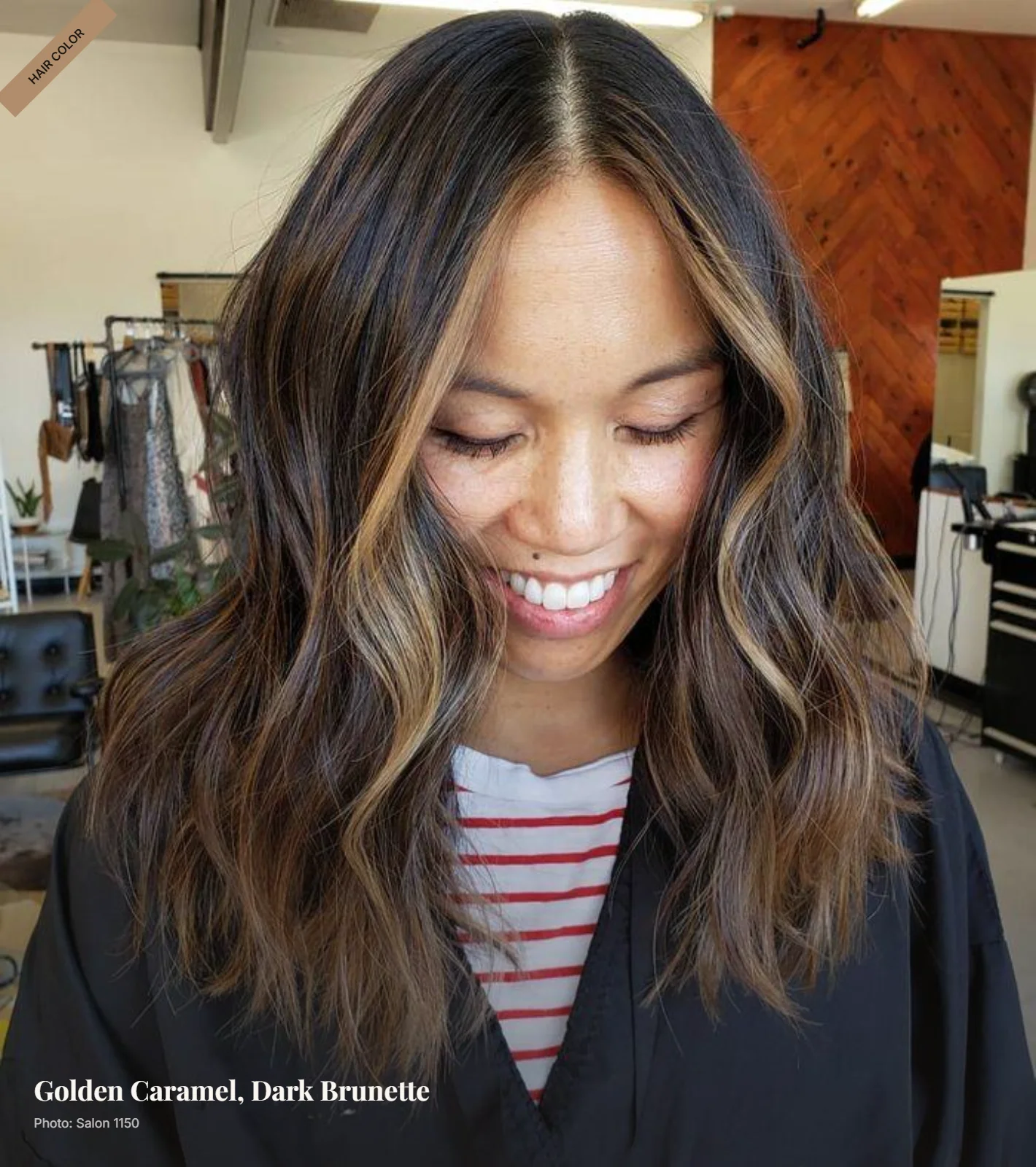 Dark brown hair with golden caramel balayage and face-framing pieces in soft waves