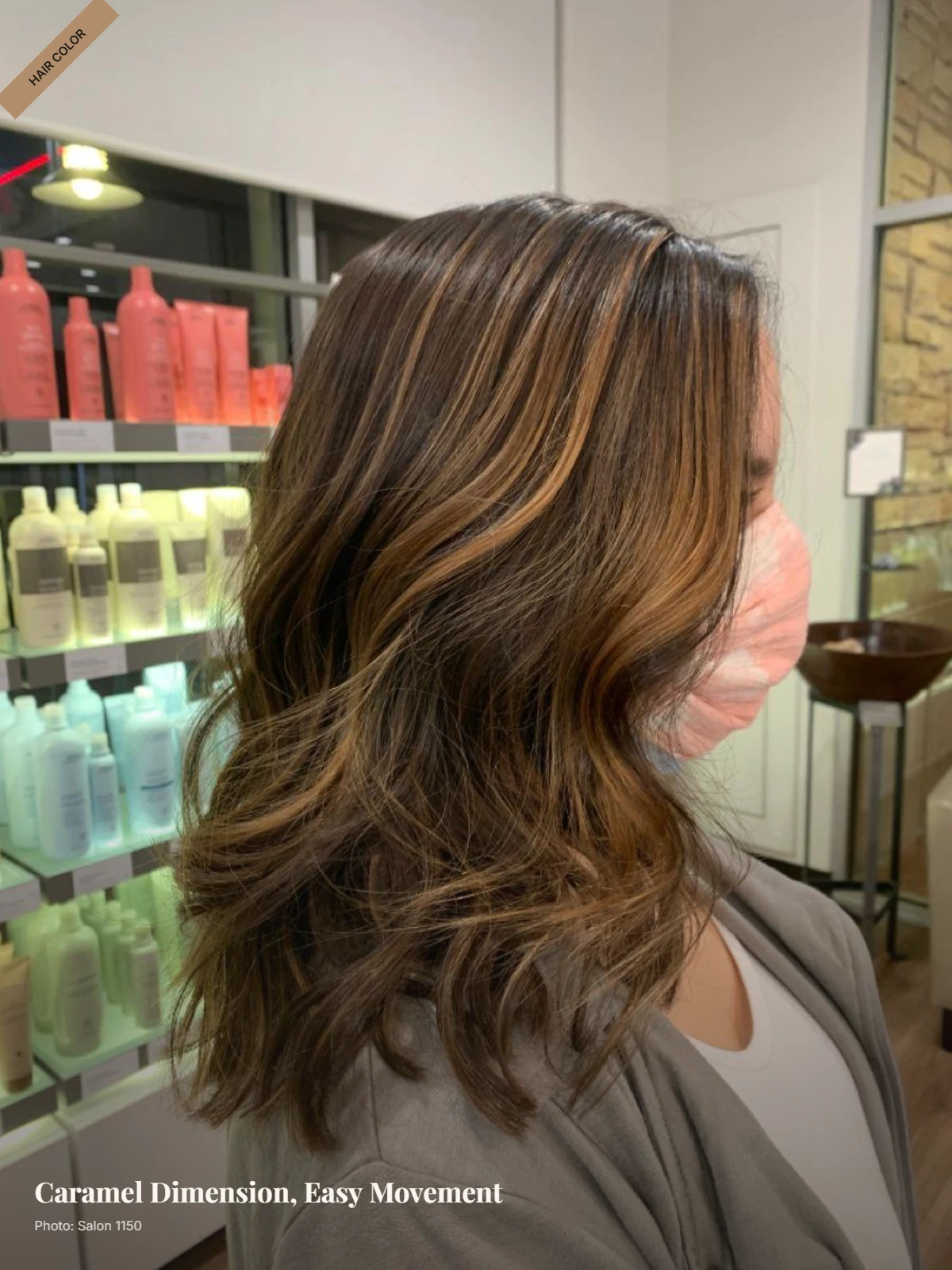 Medium-length brown hair with caramel balayage, soft layers, and loose waves
