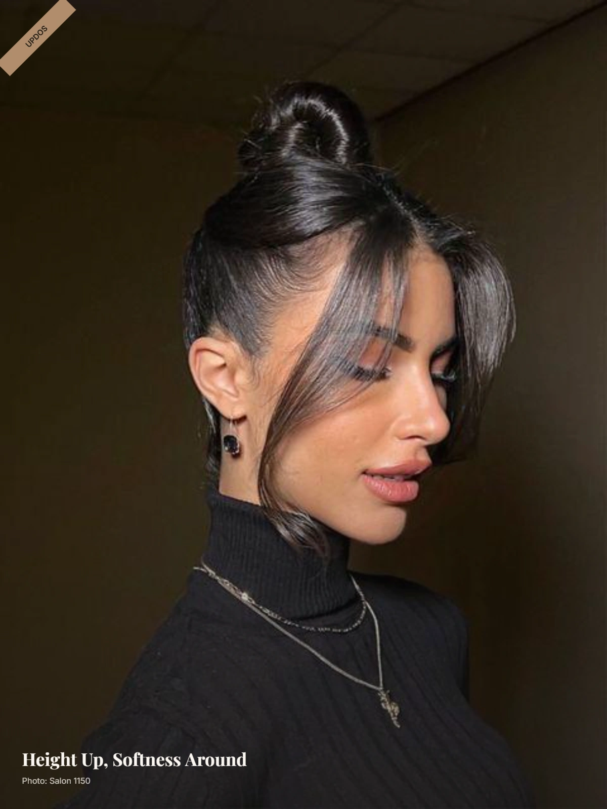 High ballerina bun with soft curtain bangs framing a round face