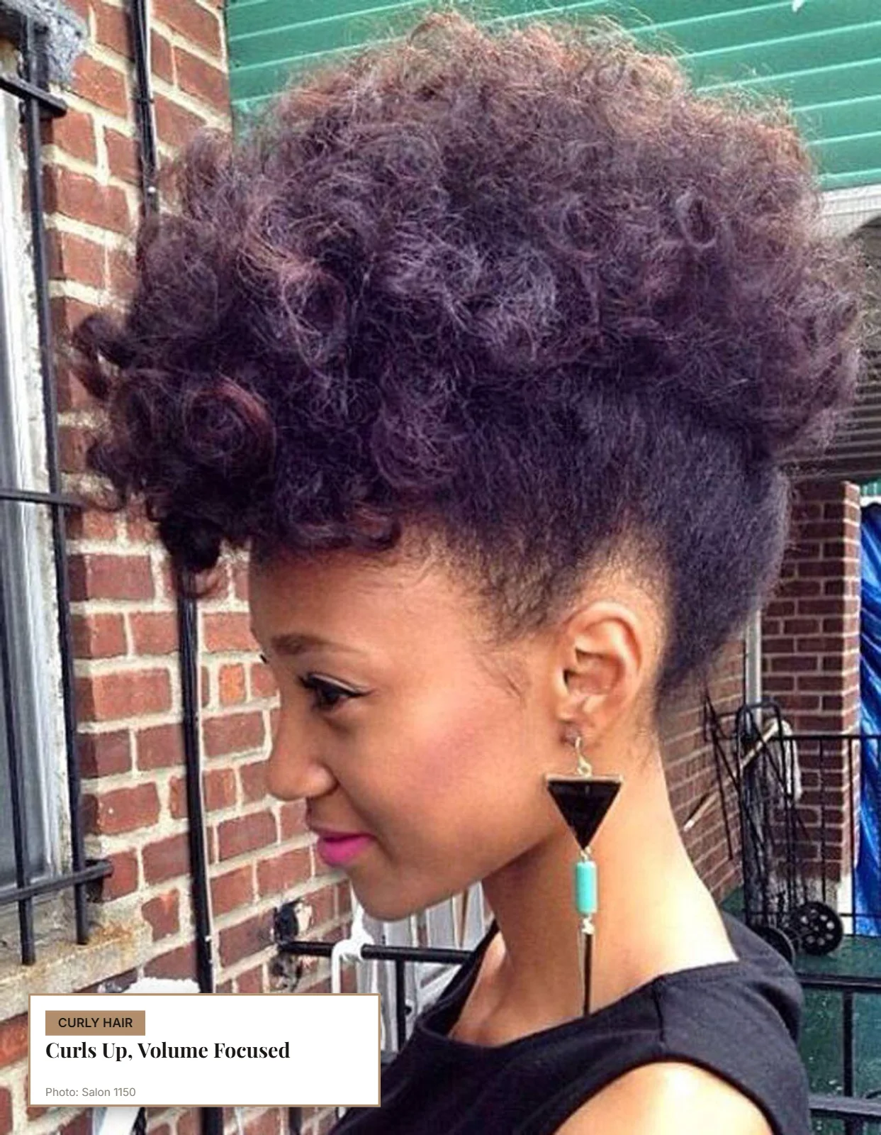Curly pompadour with lifted curls and tapered sides creating height above a round face