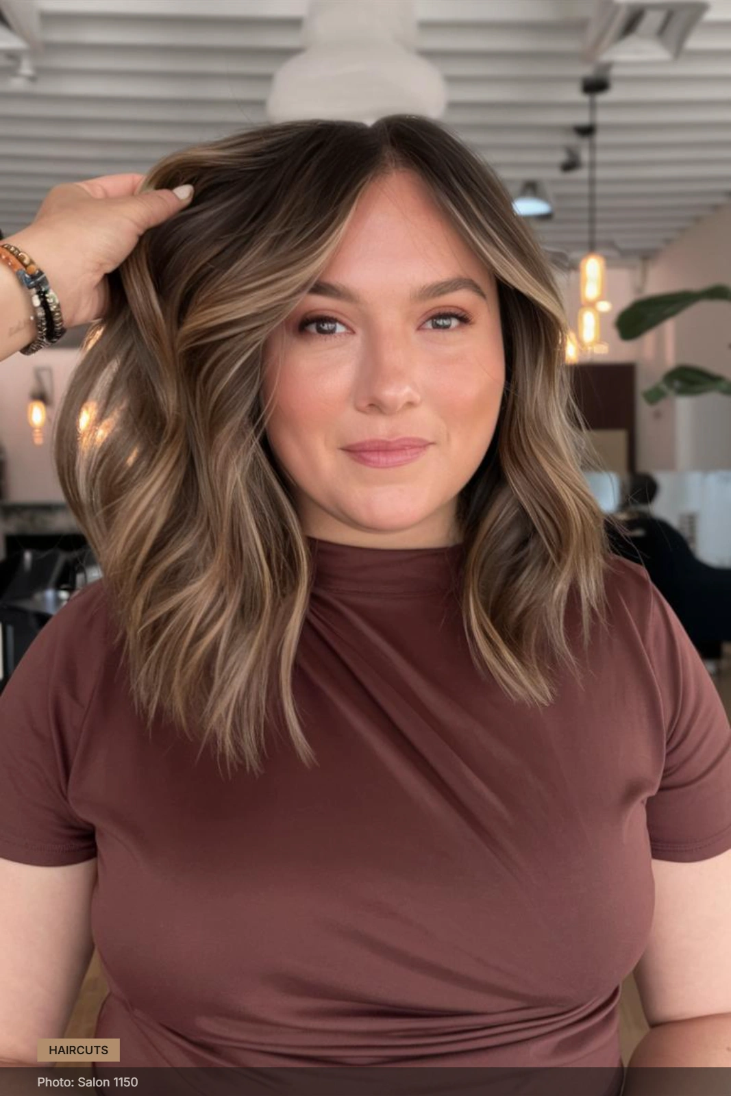 Medium-length disconnected layers with soft waves and face-framing strands around a round face