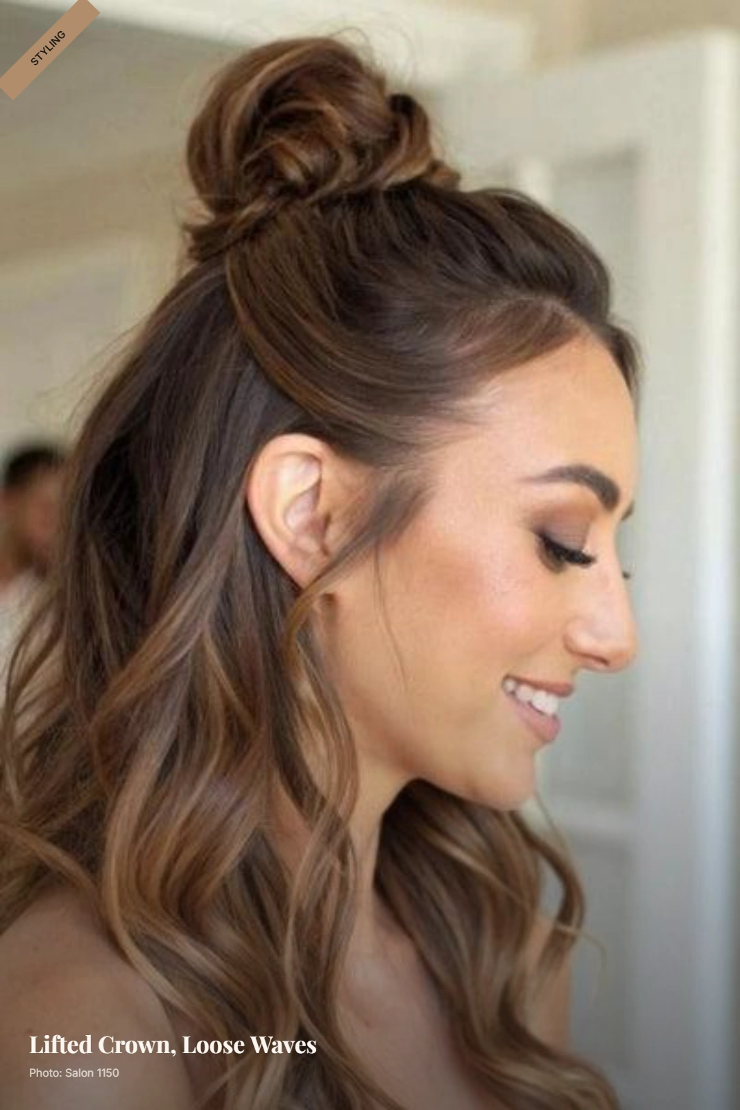 Half-up top knot with lifted crown and loose waves framing a round face