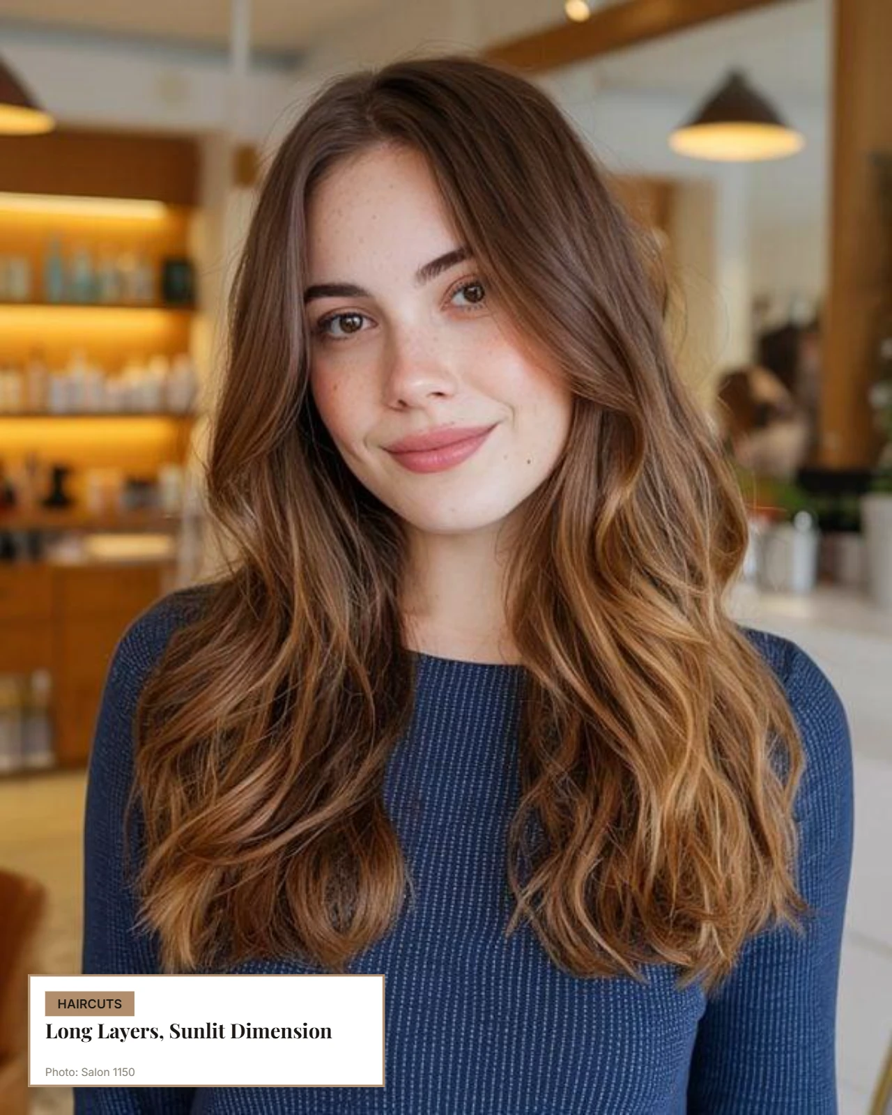 Long layered hair with soft waves and subtle sun-kissed highlights framing a round face