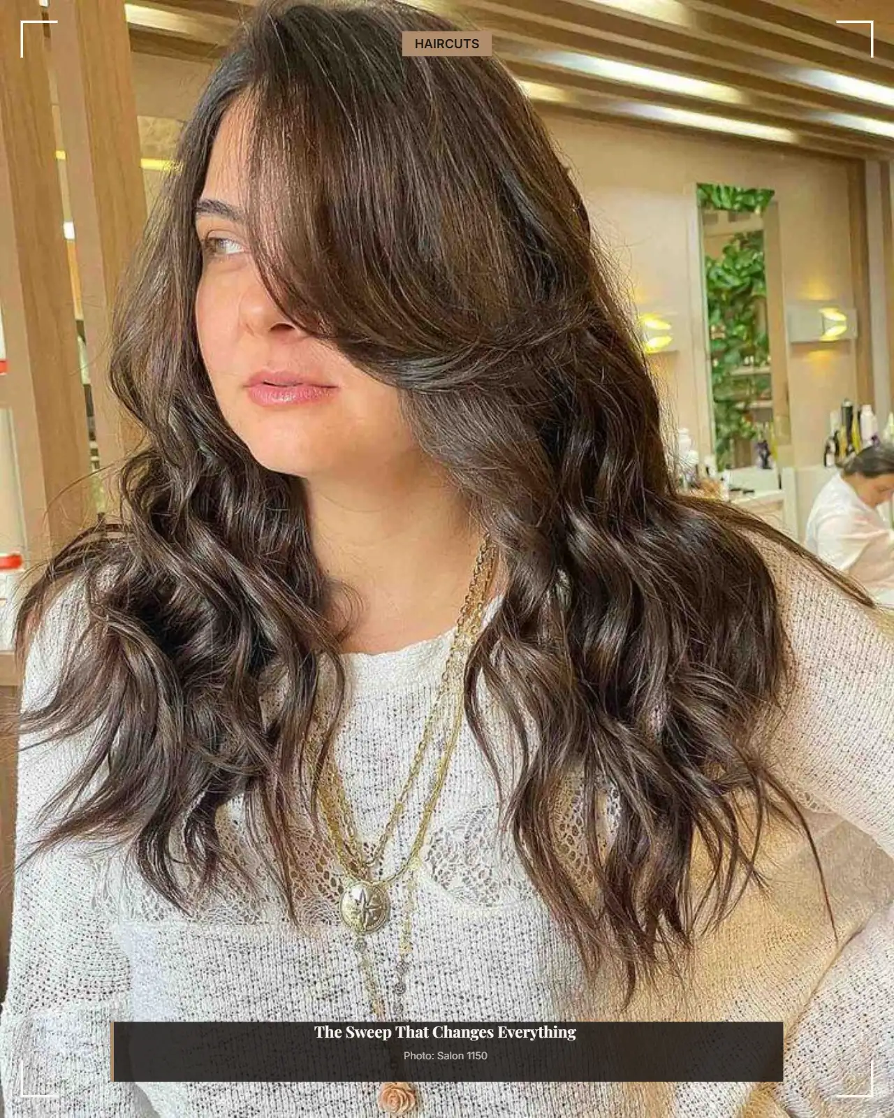Long wavy layers with a boosted side-swept bang framing a round face