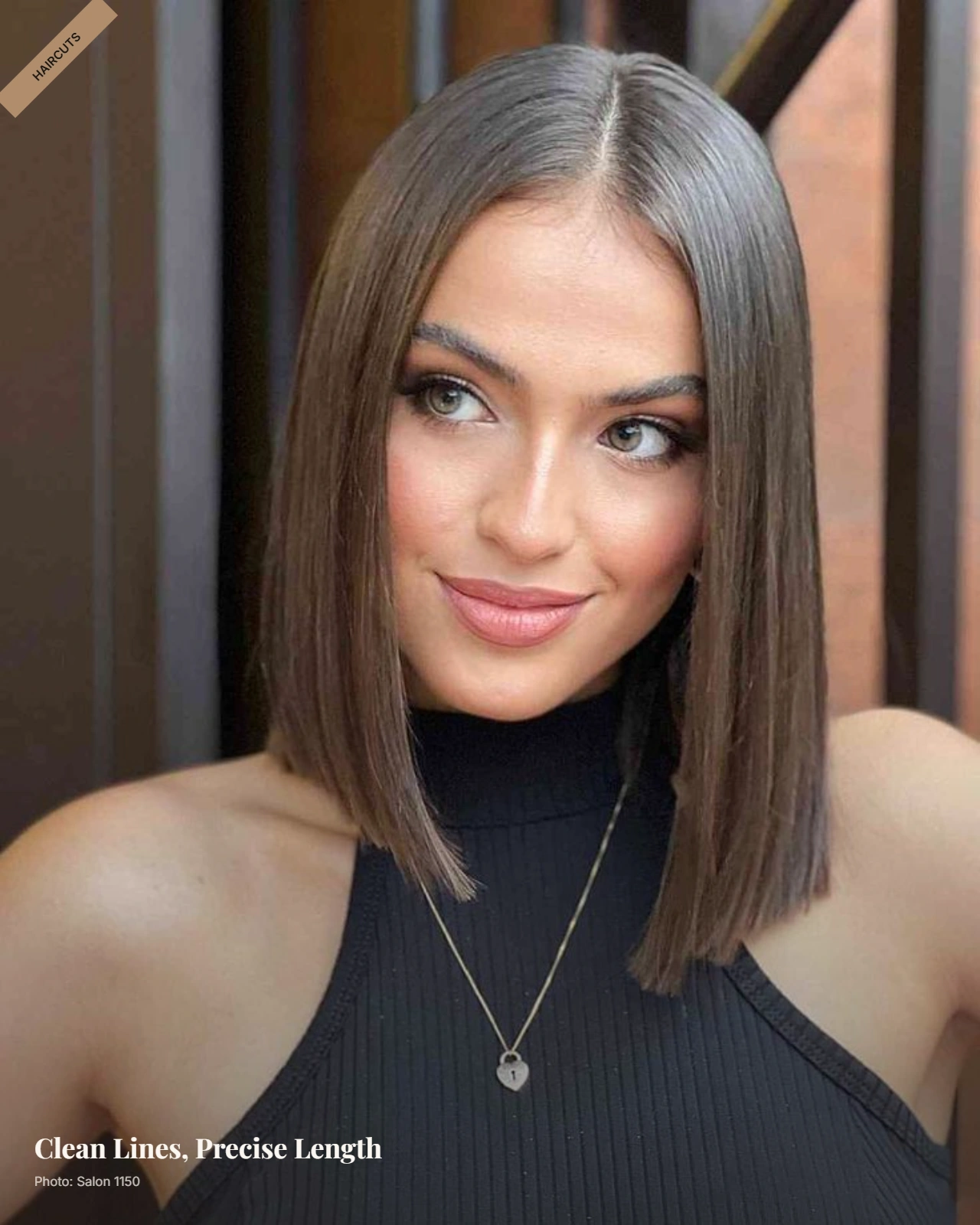Sleek straight lob with center part and clean length just past the chin