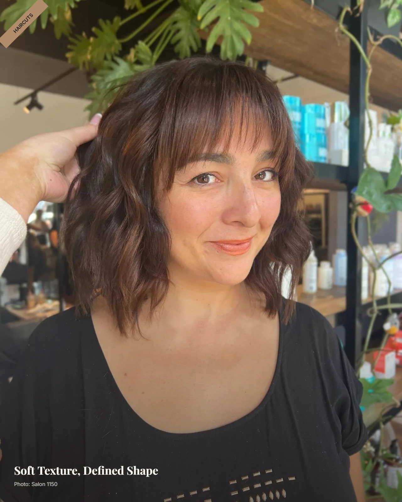 Textured lob with feathery fringe and soft layers framing a round face