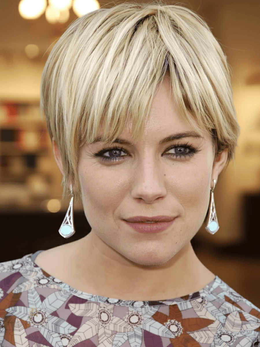 Sienna Miller with a mop crop featuring soft layers, feathered fringe, and warm blonde tones for an effortless, chic look.