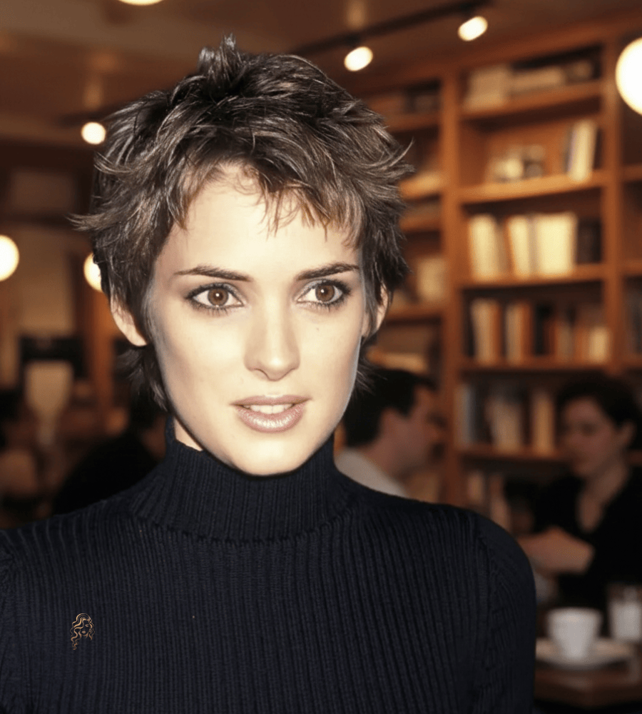 Winona Ryder with a choppy pixie cut featuring short, spiky layers and soft crown volume for a 90s-inspired finish.