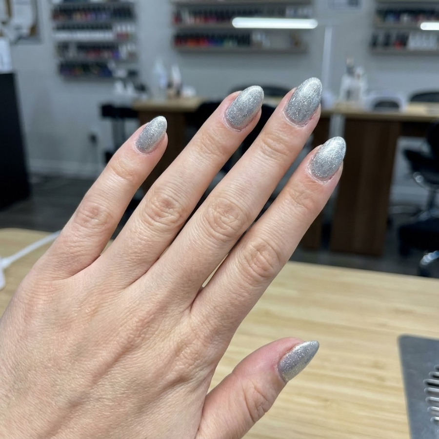 Silver tinsel Christmas nail with a soft shimmer finish