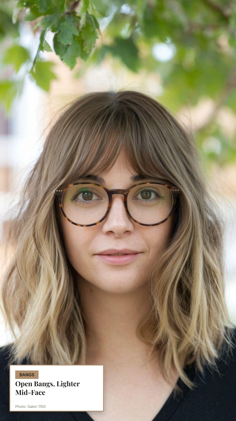 Woman with thin hair, thick glasses, and open split bangs leaving space around the frames