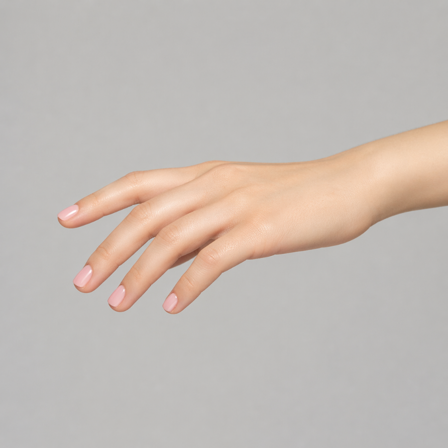 Short square nails with a soft pink ombre blending sheer baby pink into a milky pink tip with a subtle compressed gradient