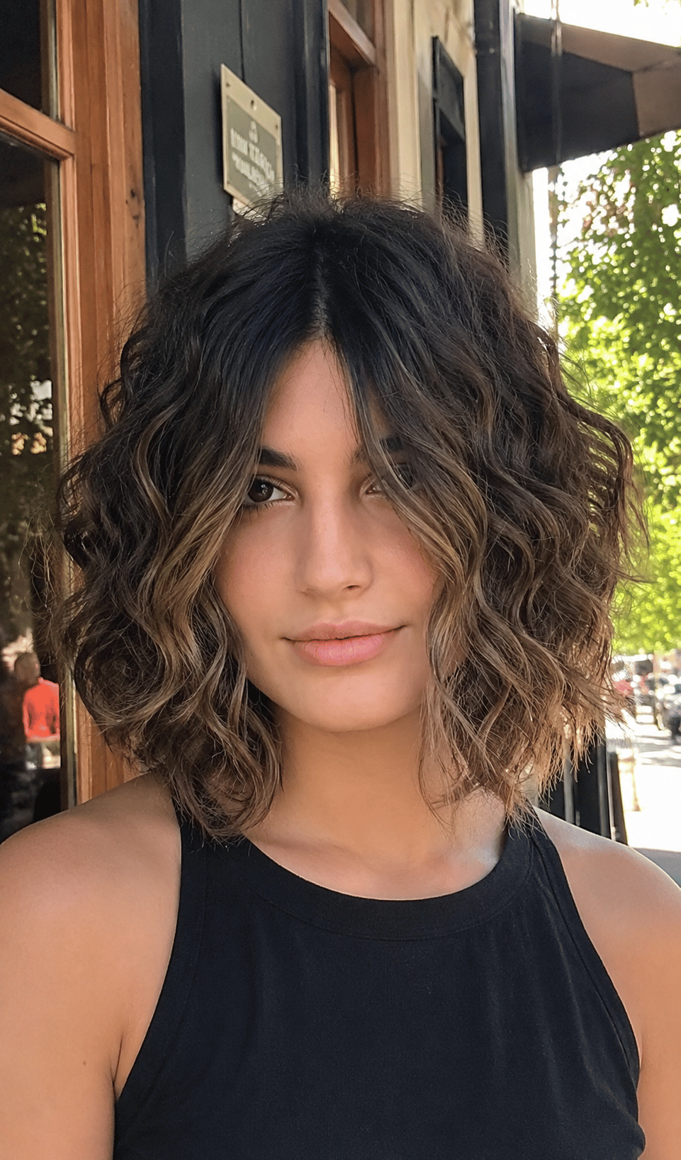 Air-dried curly jellyfish haircut showing natural curl expansion and softened disconnection on 3A to 3B curls without diffusing or styling