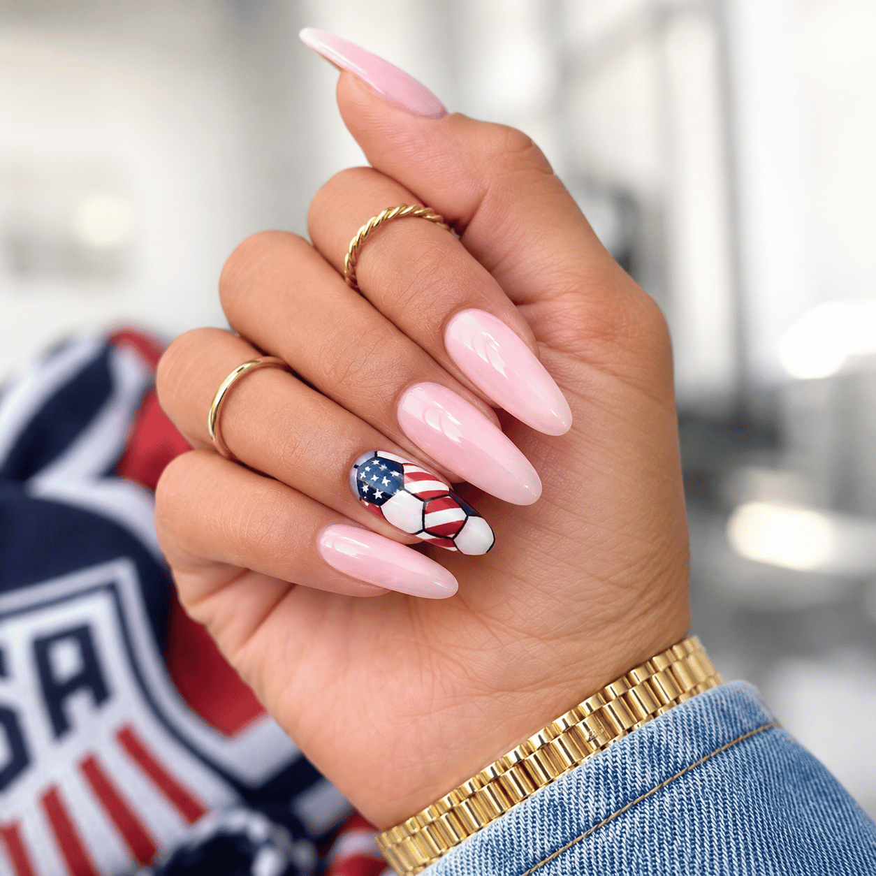 American flag soccer ball nail art on almond nails with nude base and USA-inspired accent nail for FIFA World Cup 2026
