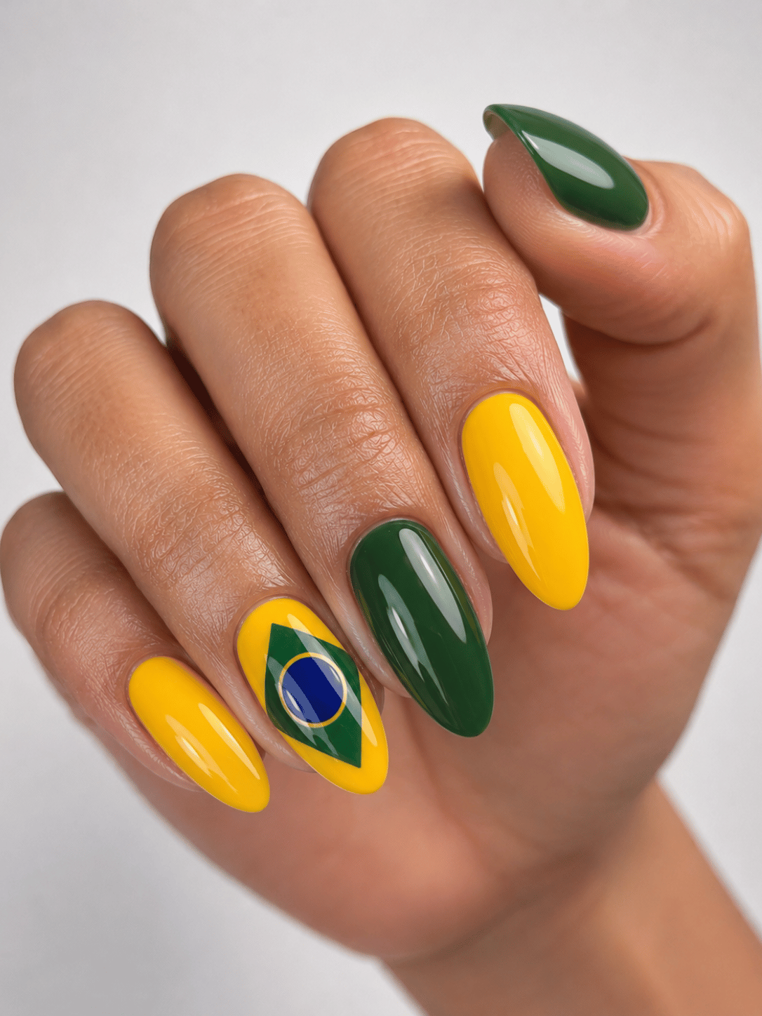 Brazil football almond nails with green and yellow manicure and hand painted Brazilian flag accent nail