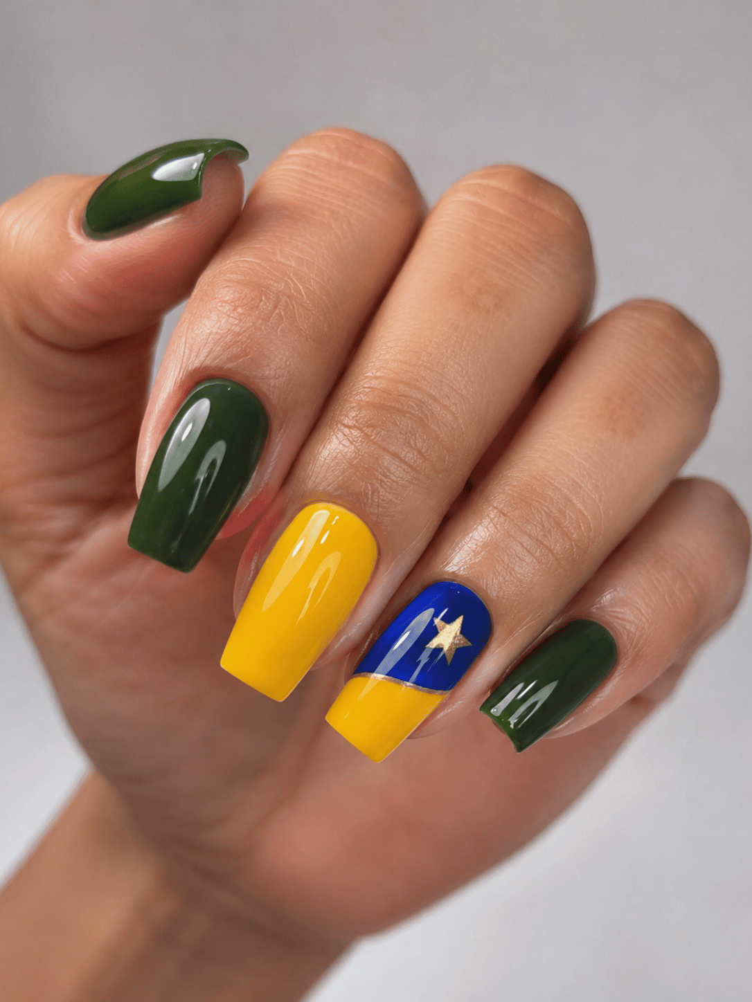 Brazil football nails with glossy green yellow coffin manicure and blue accent nail with gold star