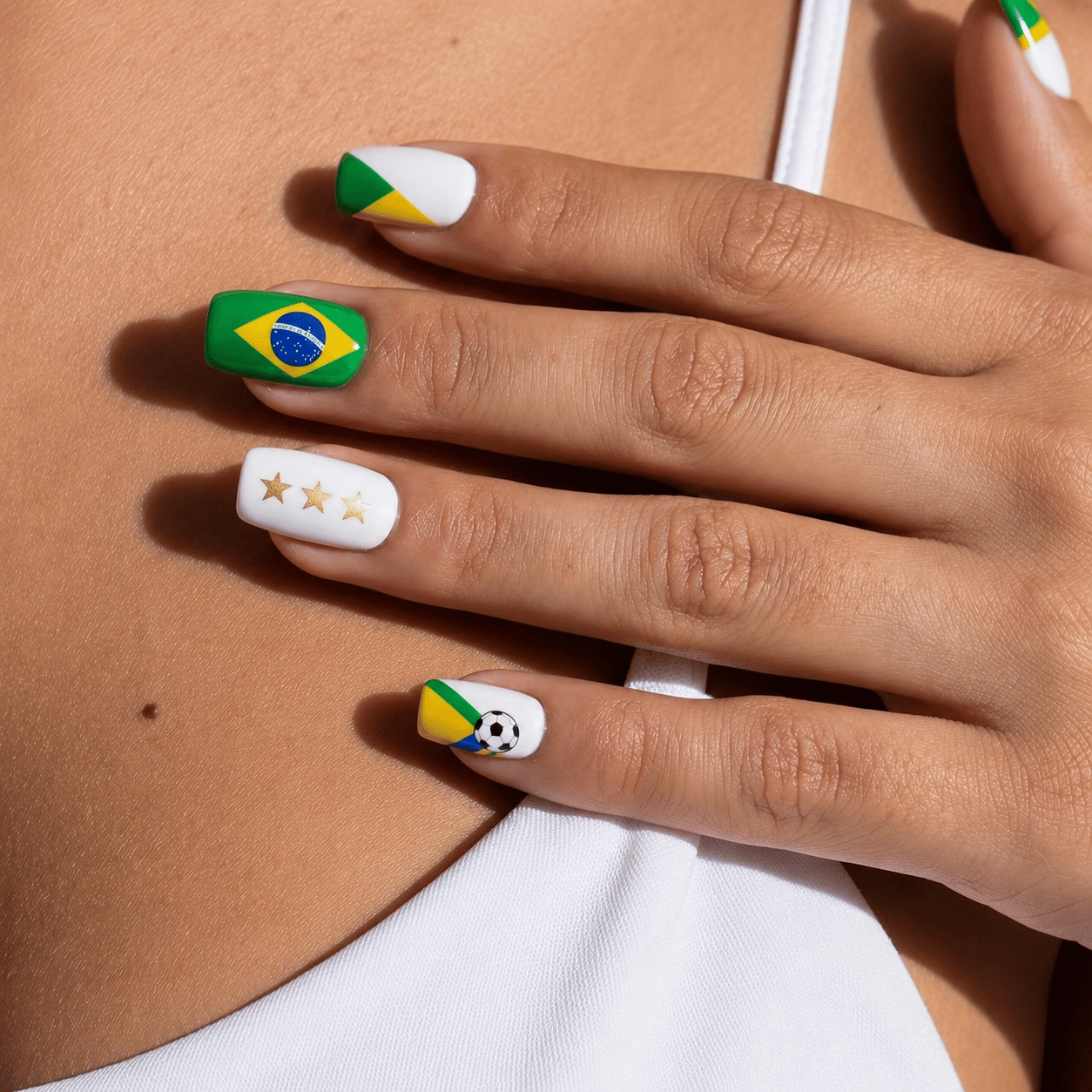 Brazil match day nails featuring green, yellow, and blue football-inspired nail art with modern Brazilian soccer fan details.