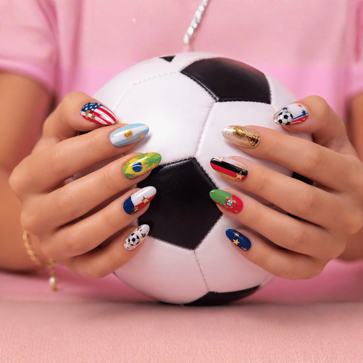 Championship celebration nails featuring metallic gold accents, football-inspired details, and festive tournament nail art.