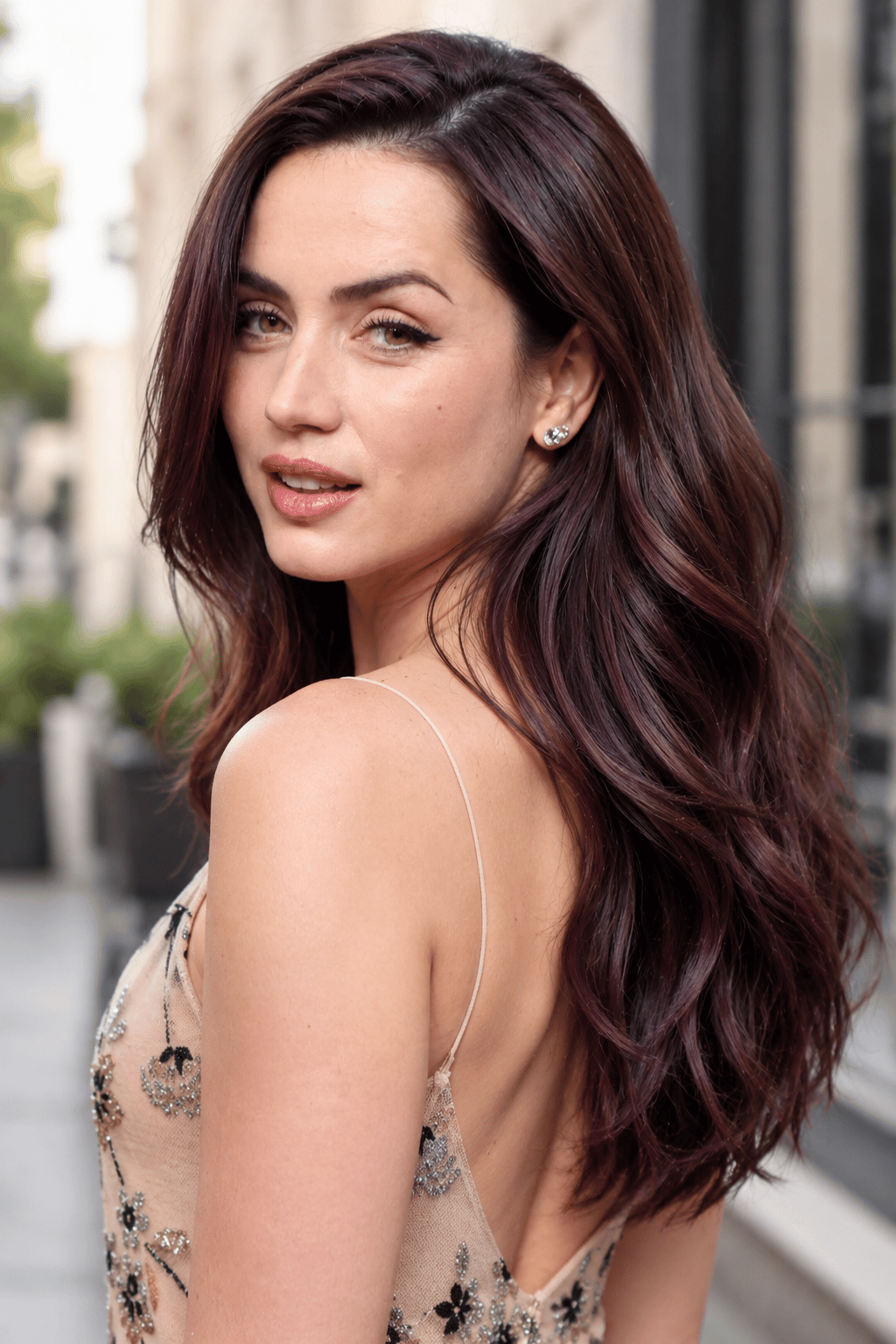 chocolate plum highlights on long brunette hair featuring subtle plum dimension blended into a rich brown base.