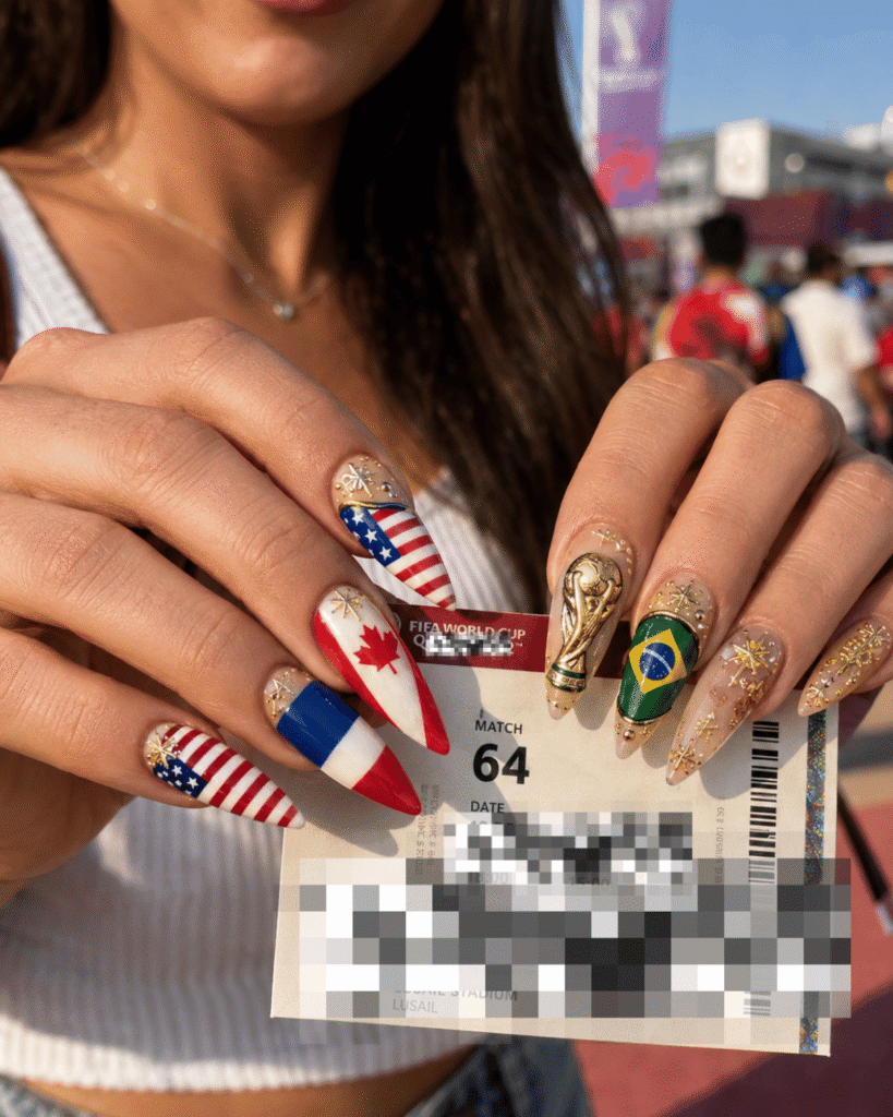 World Cup trophy nails featuring international country flags, football-inspired nail art, and gold championship details.