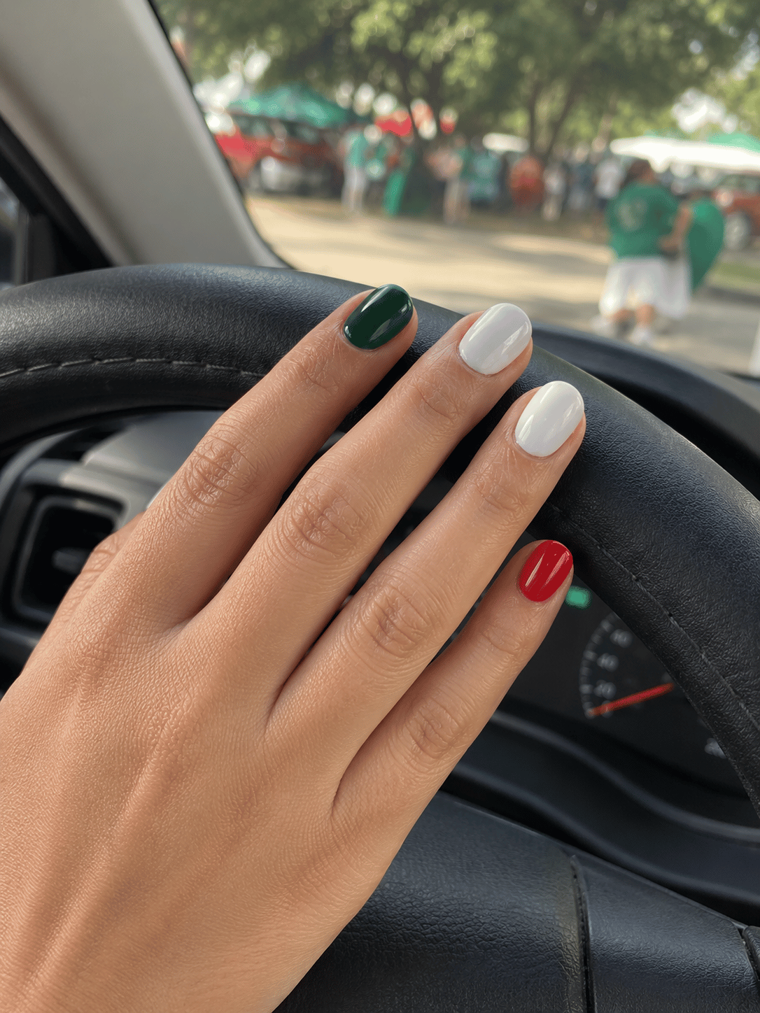 Minimalist Mexico football nails with a white base, deep forest green and red accent nails for a subtle El Tri inspired everyday manicure.