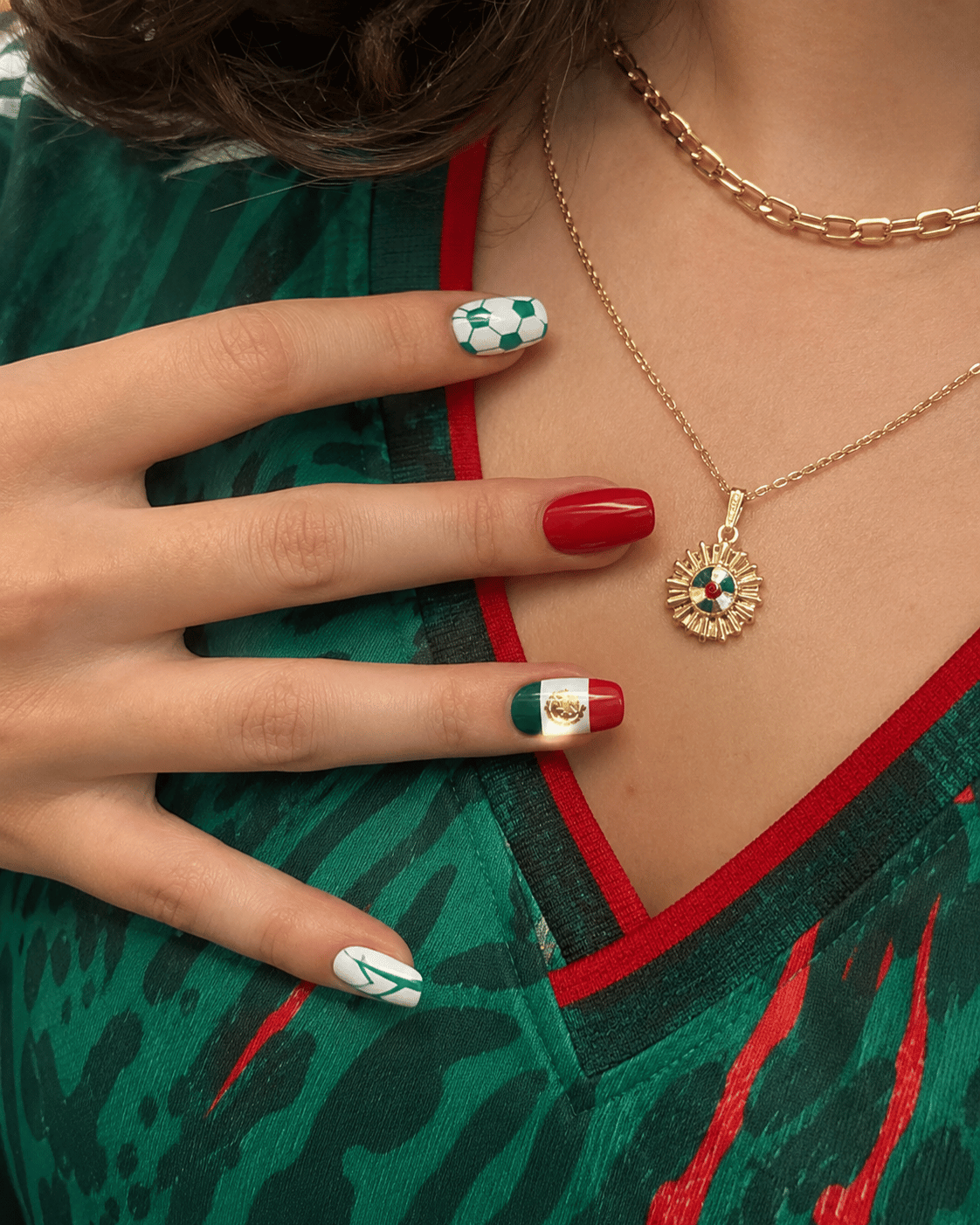 Mexico football supporter manicure with green, white and red nail art, soccer ball design, Mexican flag accent nail, and glossy gel nails in a fashion lifestyle photo