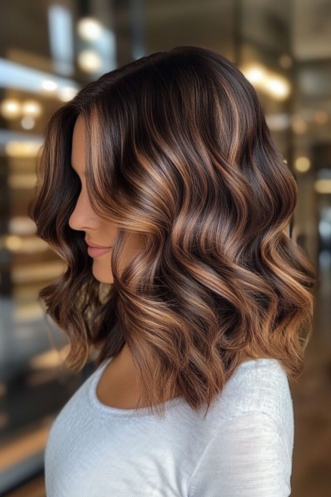 Chocolate caramel brown hair color on long wavy hair