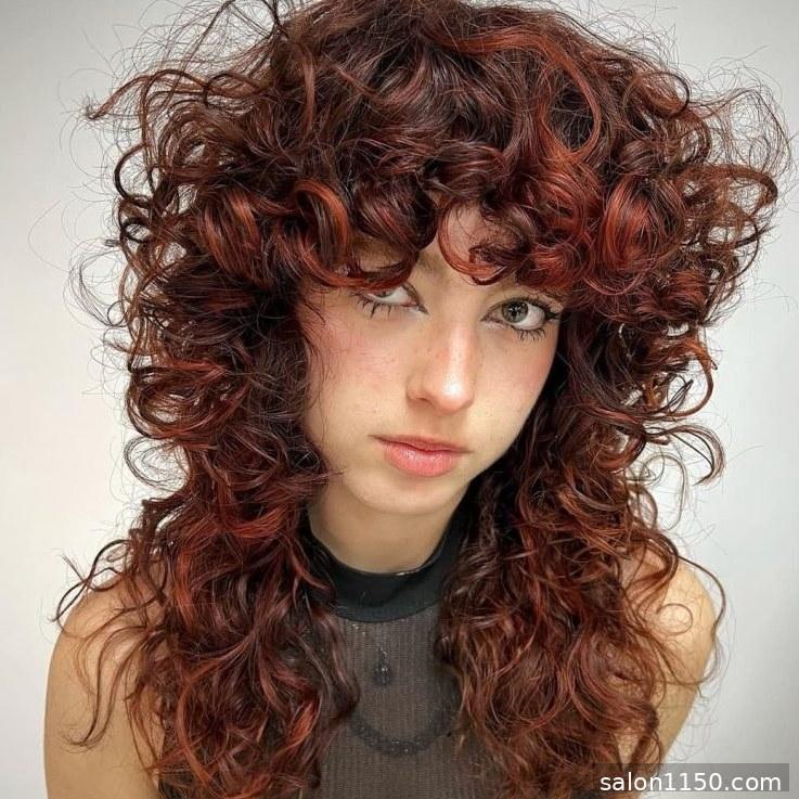 Curly wolf cut with defined copper curls and volume