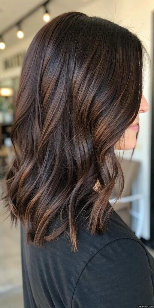 Dark bronde hair color with subtle dimension on a dark brown base