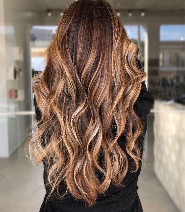 Honey caramel balayage on long dark brown hair
