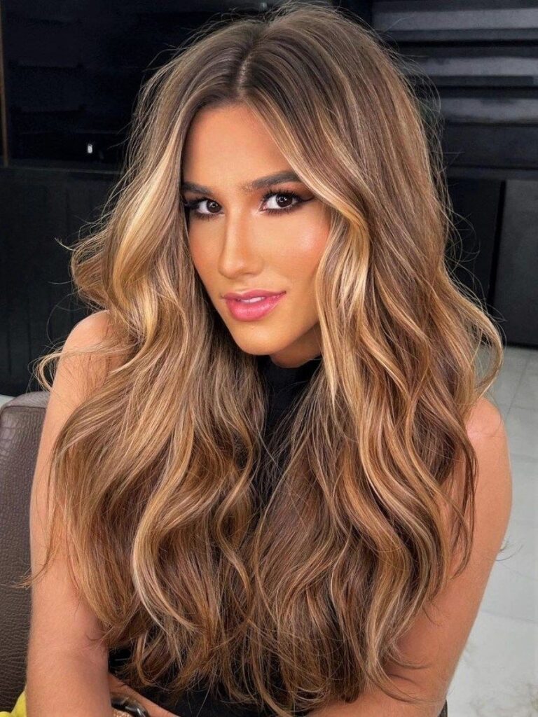 Honey caramel hair color with blonde money piece highlights