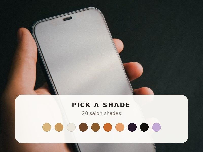 Hand holding a phone showing the hair color shade picker with 20 shades